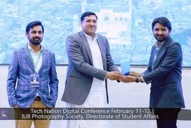 Shahzaib Ul Hassan speaking at a digital conference